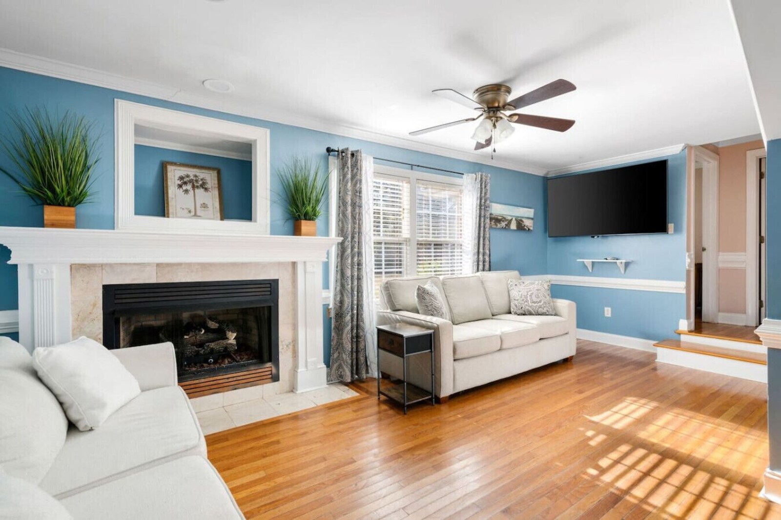 Second living room with gas fireplace and smart TV