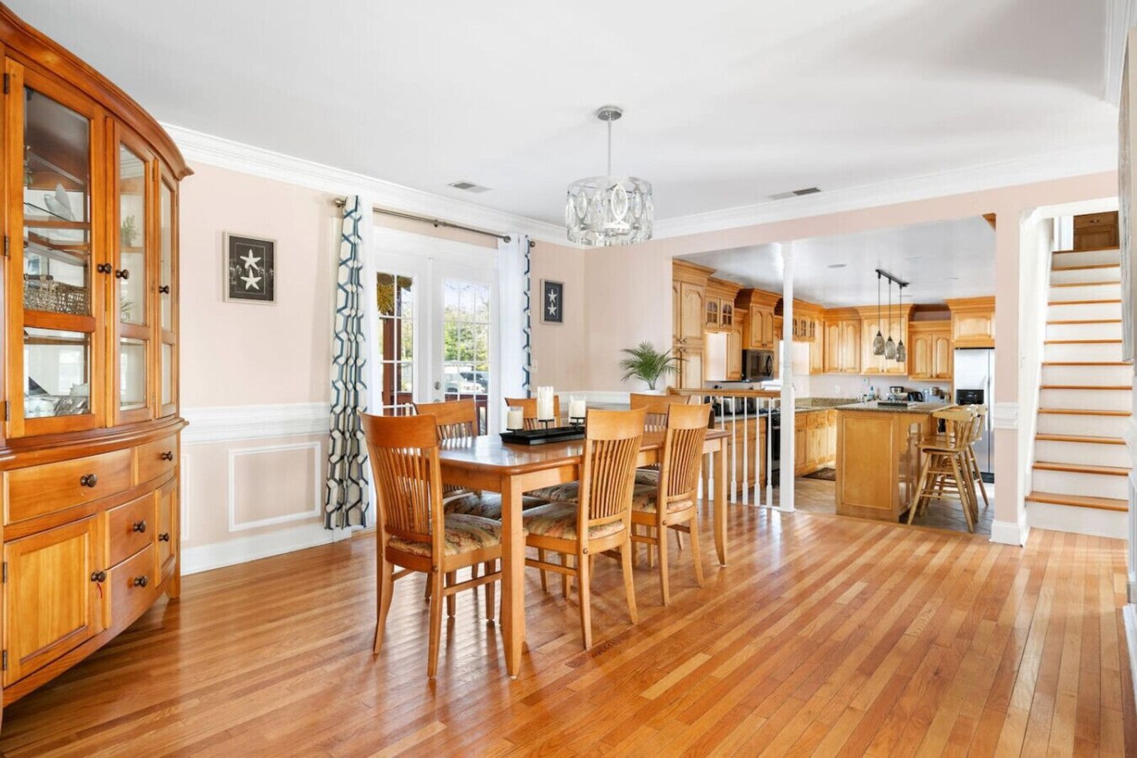 Dining area open to the fully equipped kitchen and island