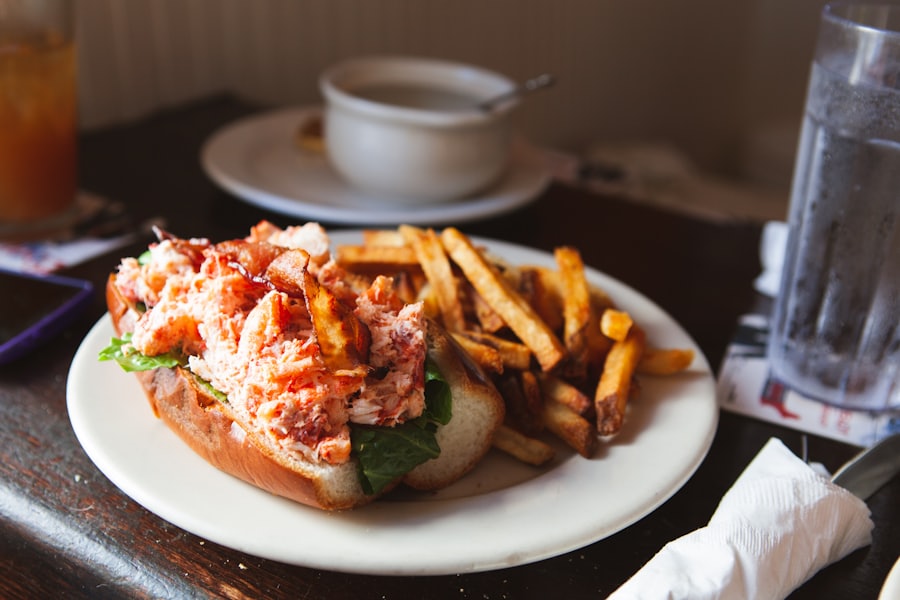 A lobster roll with fries